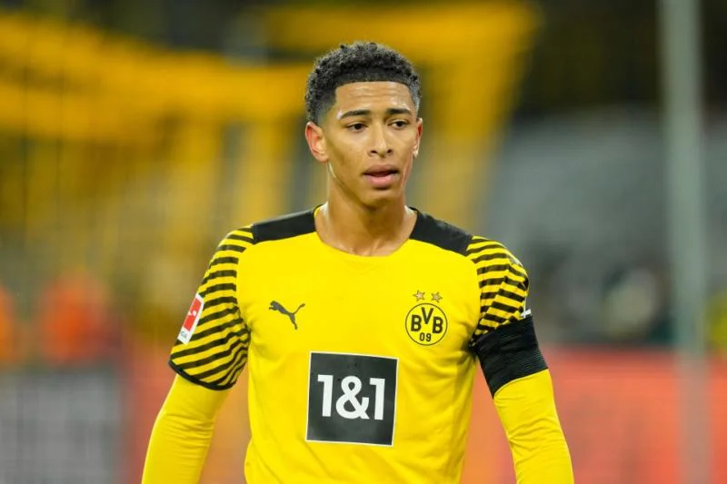 Jude Bellingham is a professional footballer from England who now plays for Borussia Dortmund in the Bundesliga and for the England national team. Bellingham plays the midfielder position.6